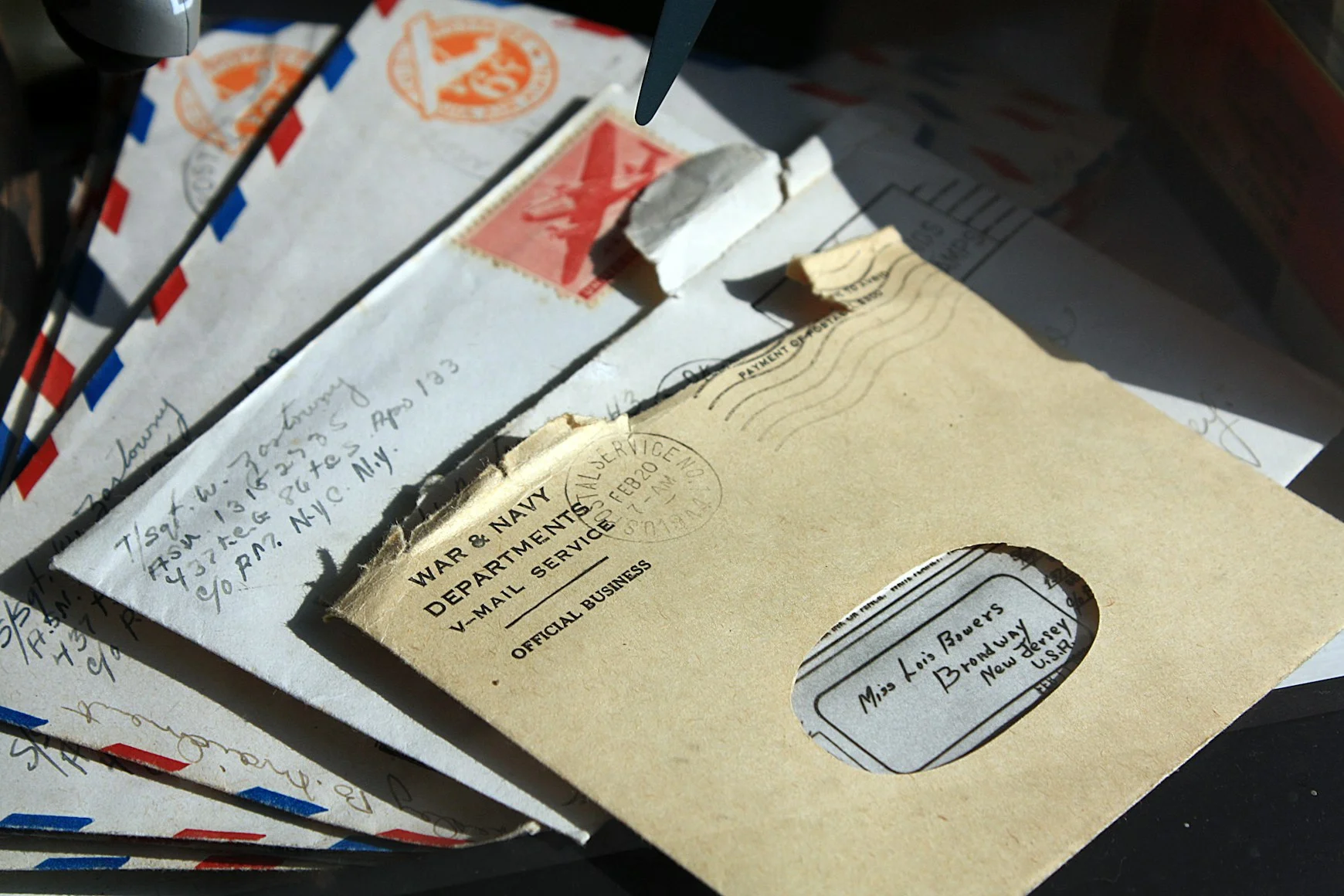 Opened envelopes spread out — Photo by sue hughes on Unsplash