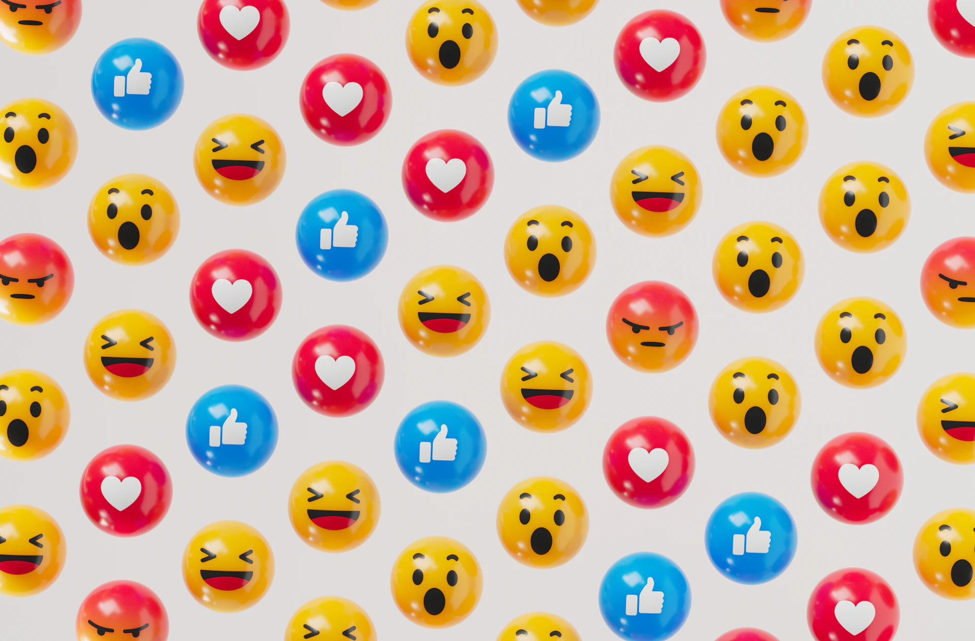 a group of smiley face balloons on a white background